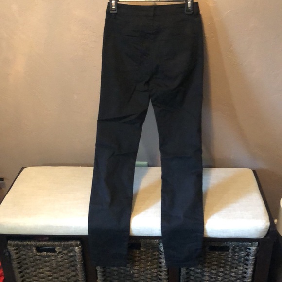 Size 4 Black stretchy jeans with holes in each leg. - Picture 4 of 5